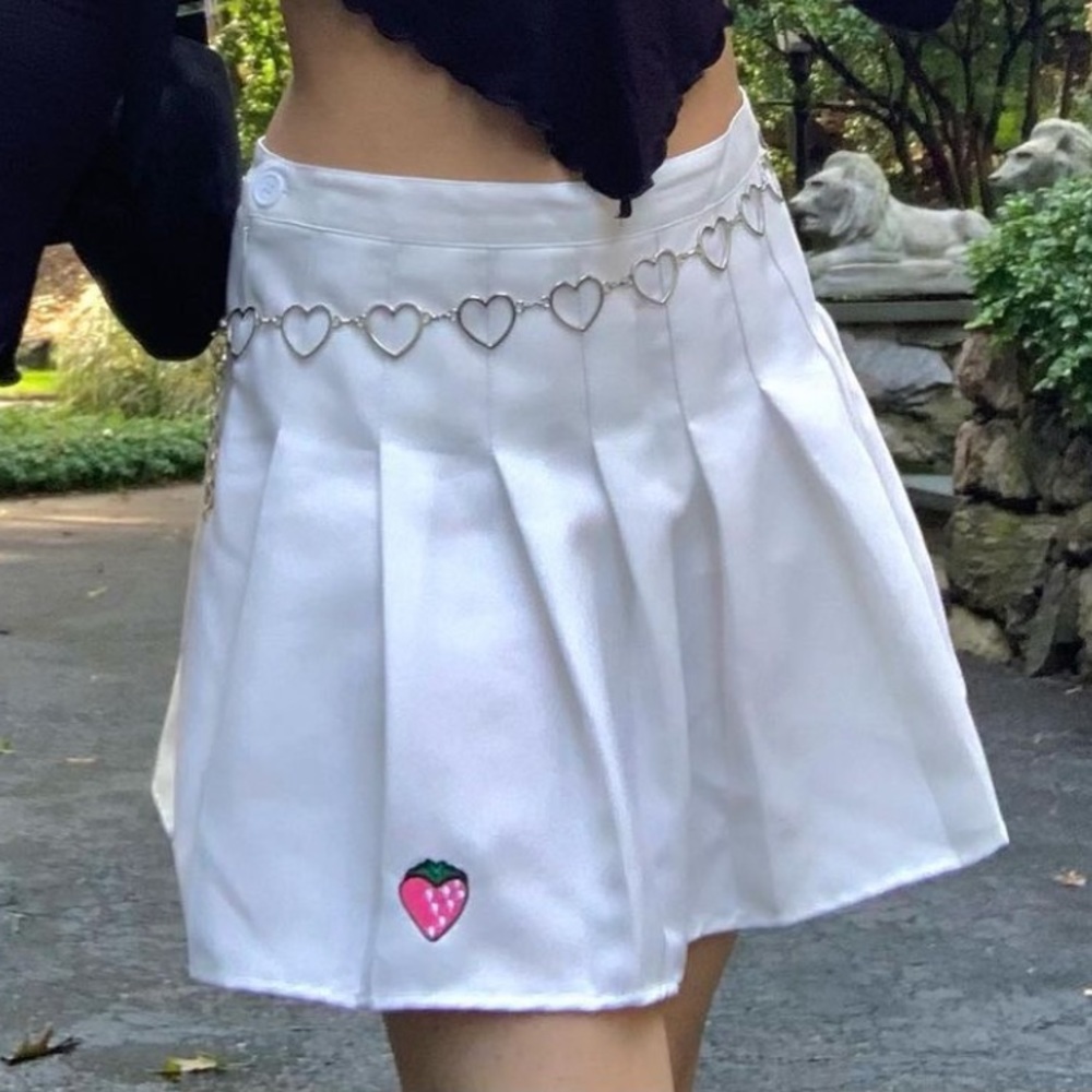 strawberry, white skirt.